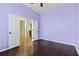 Spacious bedroom with hardwood floors and light purple walls at 7315 Coopers Hawk Dr, Hanahan, SC 29410