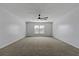 Spacious carpeted bedroom with ceiling fan and window at 7315 Coopers Hawk Dr, Hanahan, SC 29410