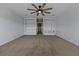 Bright bedroom with ceiling fan and built-in shelving units at 7315 Coopers Hawk Dr, Hanahan, SC 29410