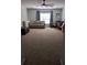 Large bonus room with carpeted floors, a sofa, and a workspace at 7315 Coopers Hawk Dr, Hanahan, SC 29410