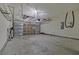 Garage interior with overhead storage and concrete floor at 7315 Coopers Hawk Dr, Hanahan, SC 29410