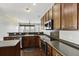 Modern kitchen features stainless steel appliances and dark wood cabinets at 7315 Coopers Hawk Dr, Hanahan, SC 29410