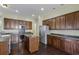 Spacious kitchen with stainless steel appliances and dark wood cabinets at 7315 Coopers Hawk Dr, Hanahan, SC 29410