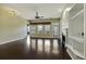 Spacious living room with hardwood floors, fireplace, and backyard access at 7315 Coopers Hawk Dr, Hanahan, SC 29410
