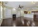 Open living room with hardwood floors, fireplace, and built-in shelving at 7315 Coopers Hawk Dr, Hanahan, SC 29410
