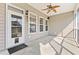 Screened porch with ceiling fan, pet door, and backyard access at 7315 Coopers Hawk Dr, Hanahan, SC 29410