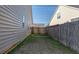 Side yard with wooden fence and gate at 7315 Coopers Hawk Dr, Hanahan, SC 29410