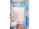 Clean bathroom with a shower/tub combo, white vanity, and blue walls at 8419 Creekstone Ct, North Charleston, SC 29406