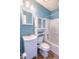 Clean bathroom with a shower/tub combo, white vanity, and blue walls at 8419 Creekstone Ct, North Charleston, SC 29406