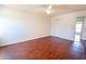 Spacious bedroom featuring wood-look floors and a ceiling fan at 8419 Creekstone Ct, North Charleston, SC 29406