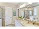 Bathroom with granite countertop, white cabinets, and a walk-in shower at 8625 Connor Ct, North Charleston, SC 29406