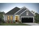 Gray Craftsman-style home with black garage door and landscaping at 8625 Connor Ct, North Charleston, SC 29406