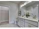 Elegant bathroom with dual vanity, large mirror, and walk-in closet at 962 Dusk Dr, Summerville, SC 29486