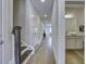 Bright hallway with hardwood floors, staircase, and access to bedrooms at 962 Dusk Dr, Summerville, SC 29486