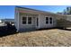 Rear view of house with patio, gray siding, and wooden fence at 962 Dusk Dr, Summerville, SC 29486