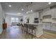 Open concept kitchen and living area with island and hardwood floors at 962 Dusk Dr, Summerville, SC 29486