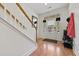 Bright entryway with hardwood floors, staircase, and coat rack at 9632 Scarborough Ct, Summerville, SC 29485
