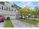 Townhome exterior showcasing landscaping and driveway at 9632 Scarborough Ct, Summerville, SC 29485