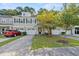 Townhome exterior with driveway, landscaping, and two-car garage at 9632 Scarborough Ct, Summerville, SC 29485