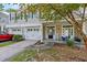 Welcoming front porch with rocking chair and two-car garage at 9632 Scarborough Ct, Summerville, SC 29485