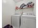 Laundry room with washer, dryer, and shelving at 9632 Scarborough Ct, Summerville, SC 29485