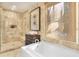 Spa-like bathroom with soaking tub, walk-in shower, and marble tile at 119 Halona Ln, Kiawah Island, SC 29455