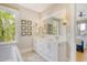 Elegant bathroom with double vanity, quartz countertop, and large mirror at 119 Halona Ln, Kiawah Island, SC 29455