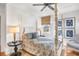 Quaint bedroom with four-poster bed and hardwood floors at 119 Halona Ln, Kiawah Island, SC 29455