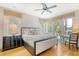 Comfortable bedroom with hardwood floors and access to a private deck at 119 Halona Ln, Kiawah Island, SC 29455