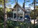 Elevated deck overlooks tranquil marsh views and wooded area at 119 Halona Ln, Kiawah Island, SC 29455