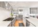 Modern kitchen with stainless steel appliances and hardwood floors at 119 Halona Ln, Kiawah Island, SC 29455