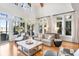Spacious living room with hardwood floors and large windows at 119 Halona Ln, Kiawah Island, SC 29455