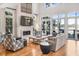 Bright living room with hardwood floors, fireplace, and stunning water views at 119 Halona Ln, Kiawah Island, SC 29455