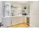 Well-organized pantry with shelves and a wine cooler at 119 Halona Ln, Kiawah Island, SC 29455