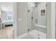 Large walk-in shower with marble tile and built-in shelving at 119 Leeward Lndg, Summerville, SC 29486