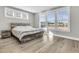 Bright bedroom with hardwood floors, large windows, and a comfy bed at 119 Leeward Lndg, Summerville, SC 29486