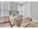 Cozy bedroom with light wood furniture and large windows at 119 Leeward Lndg, Summerville, SC 29486