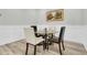 Small breakfast nook with glass table and four chairs at 119 Leeward Lndg, Summerville, SC 29486