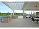 Outdoor kitchen with grill and seating area near pool at 119 Leeward Lndg, Summerville, SC 29486