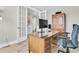 Home office with built-in wooden desk and chair at 119 Leeward Lndg, Summerville, SC 29486