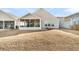 Tan house exterior with screened porch and grassy backyard at 119 Leeward Lndg, Summerville, SC 29486
