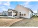Tan house exterior with screened porch and landscaping at 119 Leeward Lndg, Summerville, SC 29486