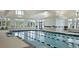 Indoor lap pool with spa and seating area at 119 Leeward Lndg, Summerville, SC 29486