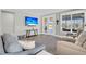 Spacious living room with hardwood floors, comfortable seating and large TV at 119 Leeward Lndg, Summerville, SC 29486