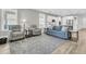 Open living room with hardwood floors, comfortable seating, and kitchen views at 119 Leeward Lndg, Summerville, SC 29486