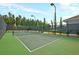 Newly resurfaced tennis court with net at 119 Leeward Lndg, Summerville, SC 29486