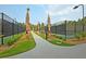 Pathway leading to well-lit tennis courts at 119 Leeward Lndg, Summerville, SC 29486