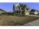 Landscaped lawn and two-story house with a two-car garage at 1209 Hammrick Ln, Johns Island, SC 29455