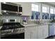 Stainless steel appliances and white cabinetry in this kitchen at 1209 Hammrick Ln, Johns Island, SC 29455