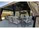 Outdoor patio with covered seating area and TV at 1209 Hammrick Ln, Johns Island, SC 29455